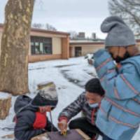 students journaling in the snow